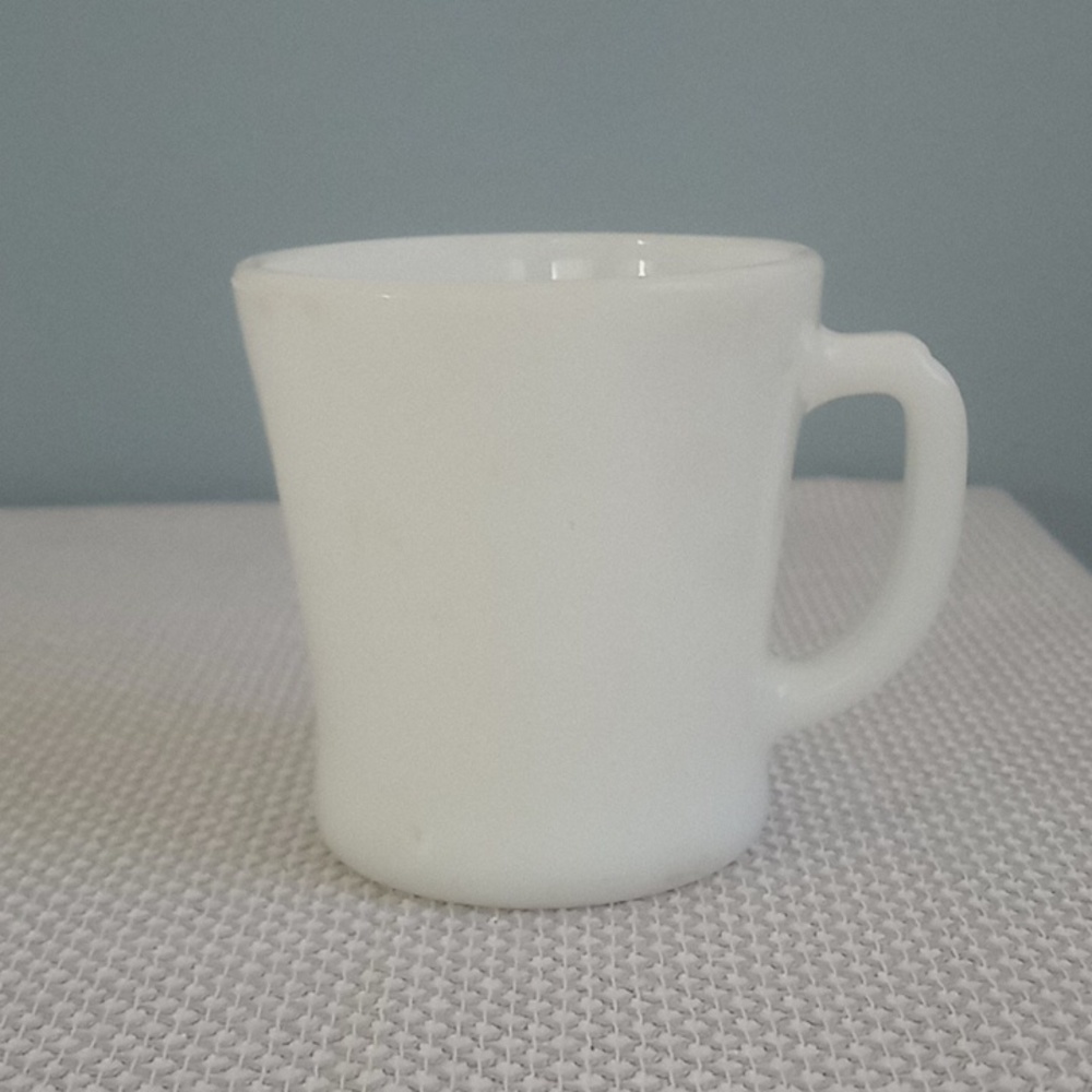 Vintage FireKing D handled white coffee cup.